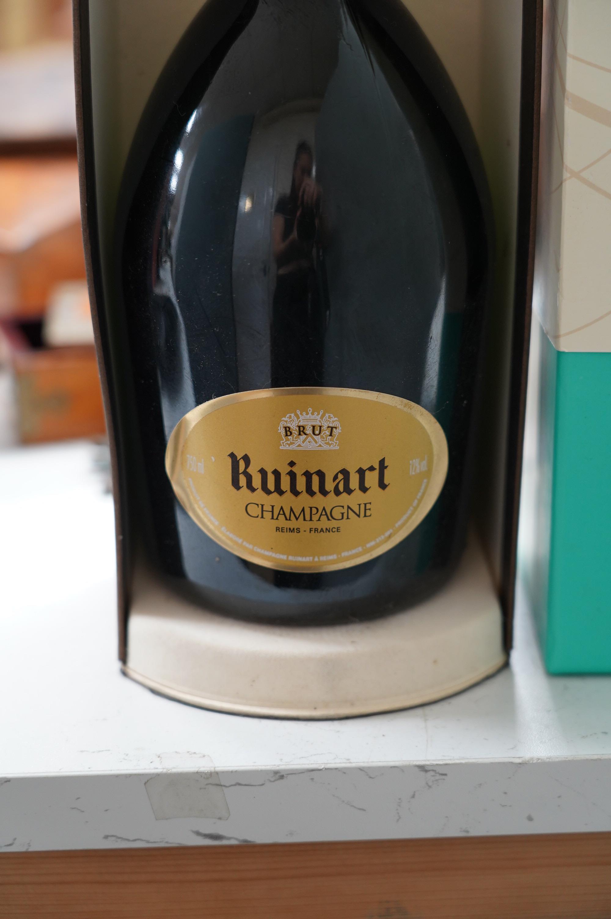 A bottle of Fortnum and Mason champagne, together with a bottle of Ruinart champagne (2). Condition - good